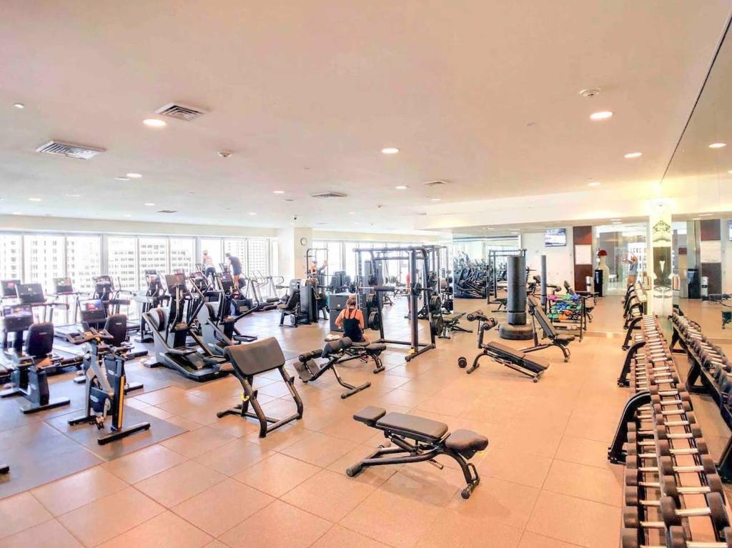 a gym with a lot of treadms and pilates equipment at Sky High Penthouse Corner 2BR 2BA Icon Brickell in Miami