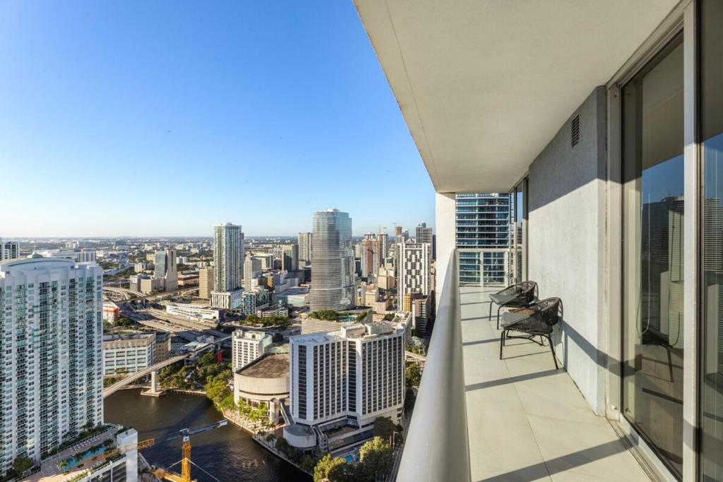 a balcony with a view of a city at Sky High Penthouse Corner 2BR 2BA Icon Brickell in Miami