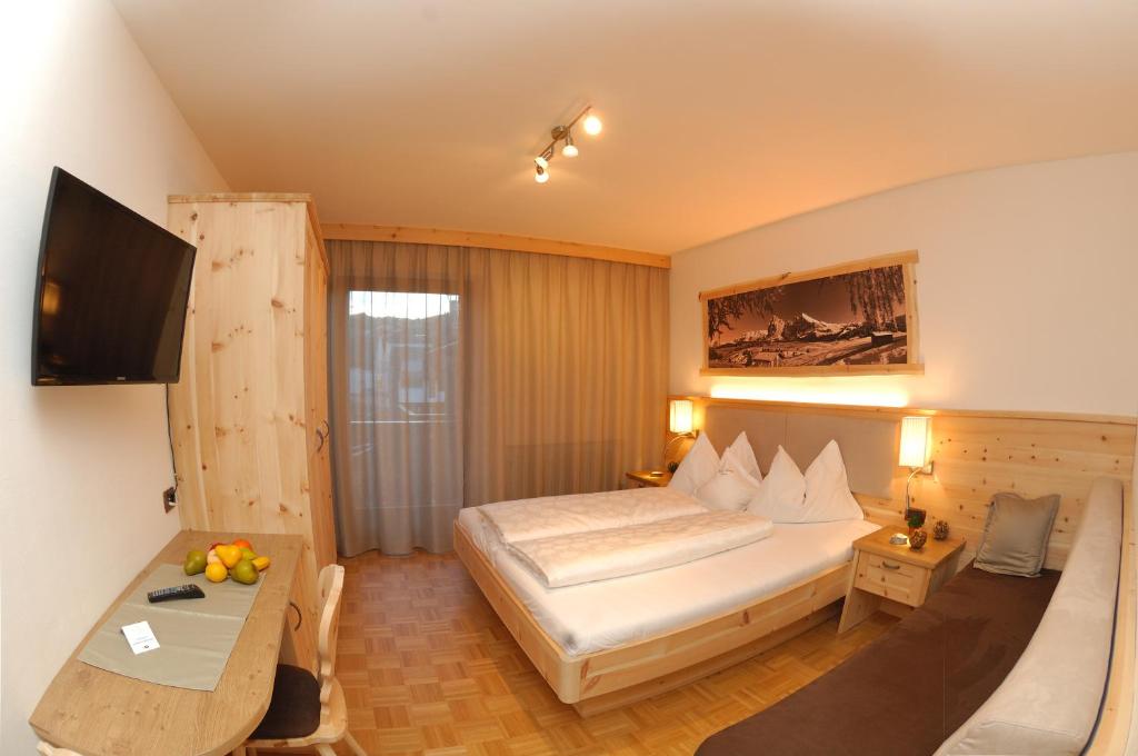 Postel nebo postele na pokoji v ubytování Hotel Garni Savoy - new opening