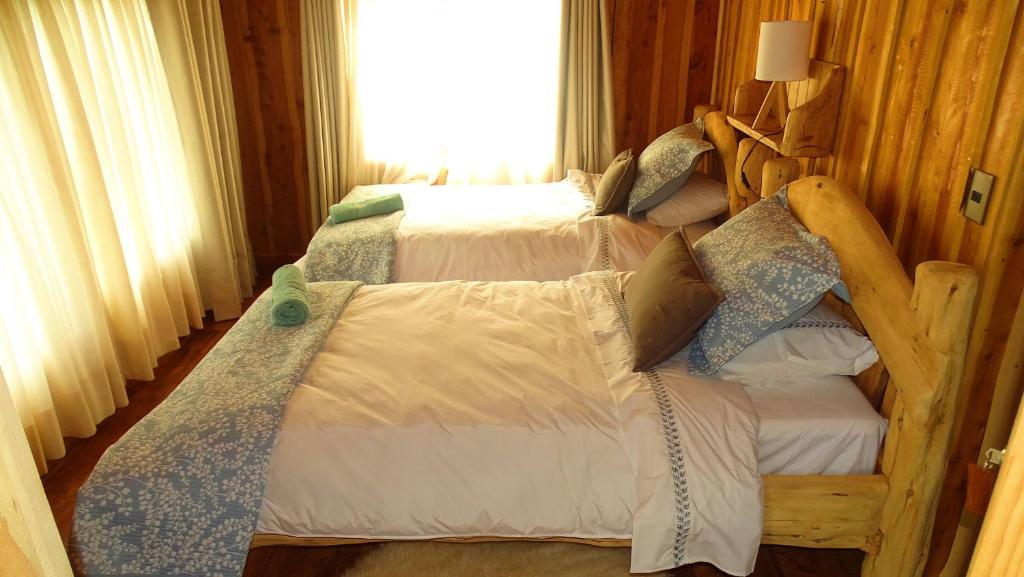 Postel nebo postele na pokoji v ubytování Refugio del Chucao