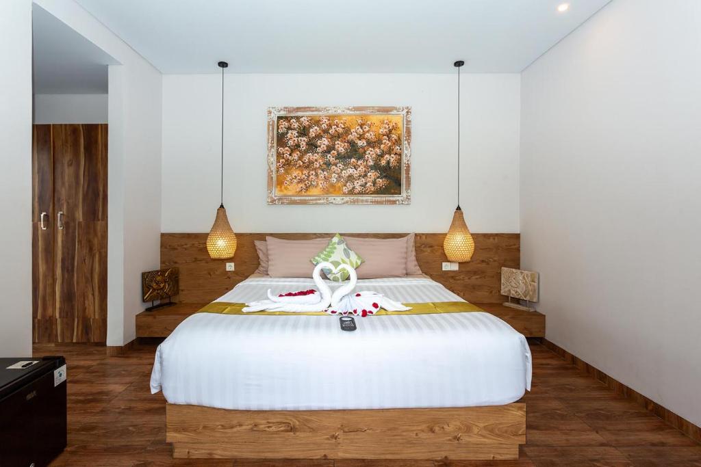 Postel nebo postele na pokoji v ubytování Graha Shanti Guest House