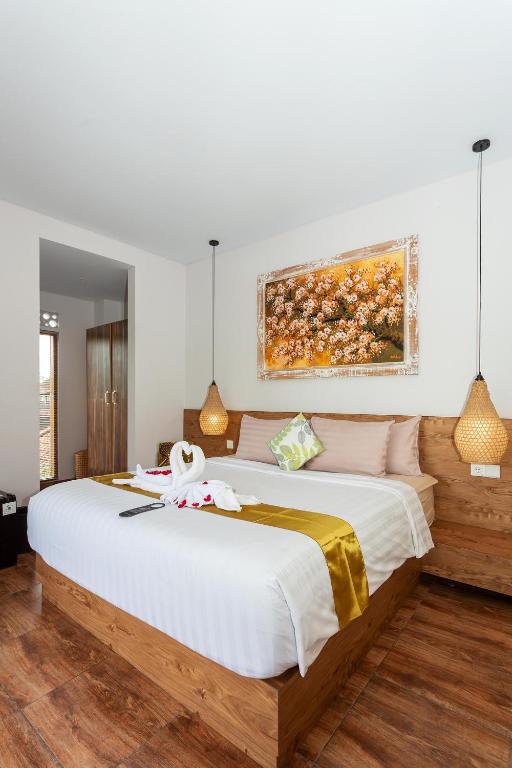 Postel nebo postele na pokoji v ubytování Graha Shanti Guest House