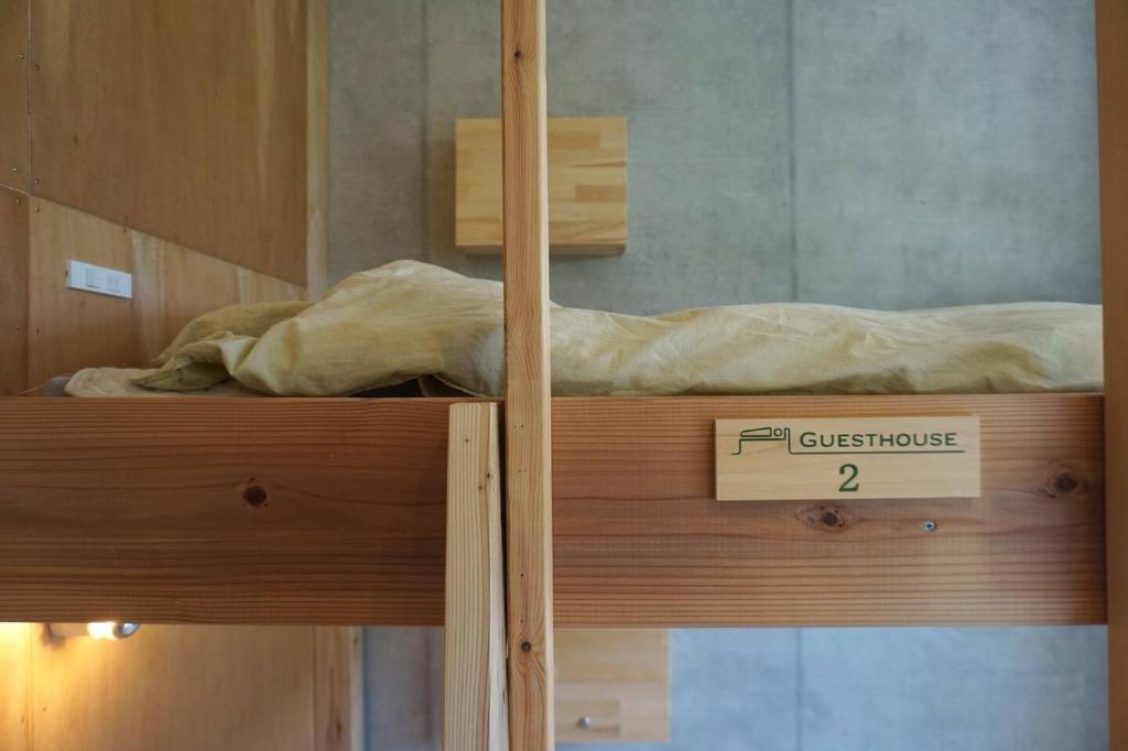 Postel nebo postele na pokoji v ubytování Heguri Hub