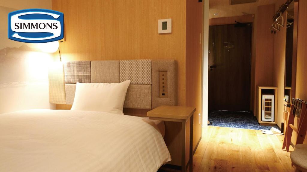 Postel nebo postele na pokoji v ubytování Hotel Nostal Yokote