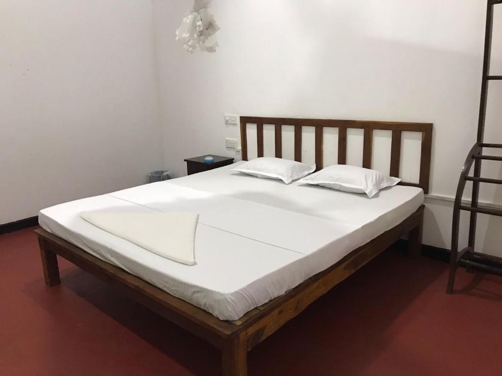 Postel nebo postele na pokoji v ubytování Greenwood Hotel Sigiriya