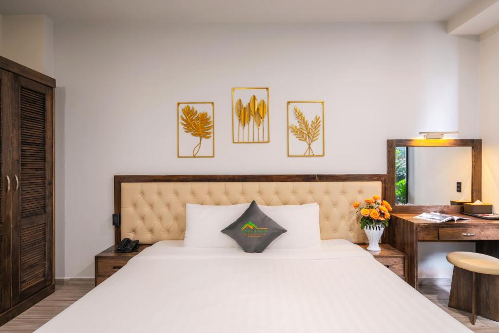 Postel nebo postele na pokoji v ubytování Greenview City Hotel