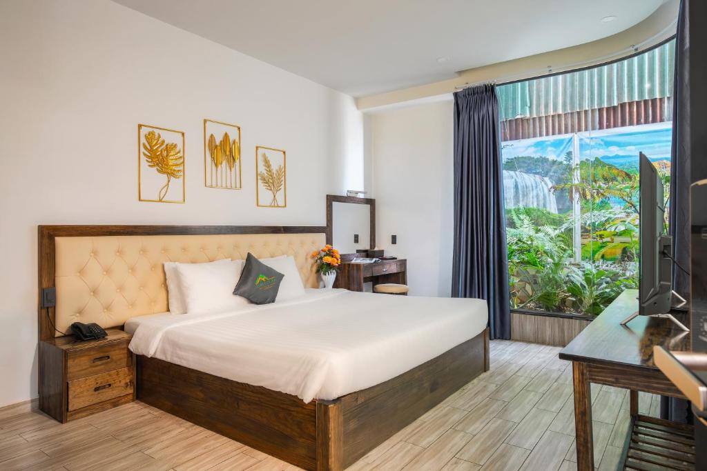 Postel nebo postele na pokoji v ubytování Greenview City Hotel