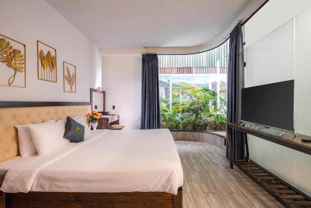 Postel nebo postele na pokoji v ubytování Greenview City Hotel