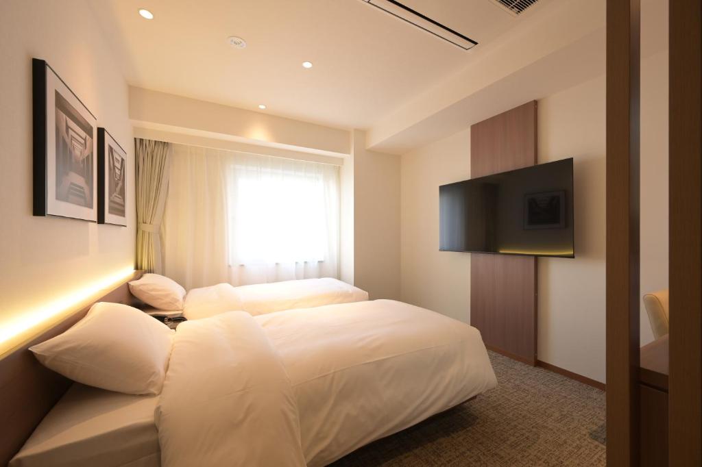 TV a/nebo společenská místnost v ubytování COCOYO Hotel 大塚