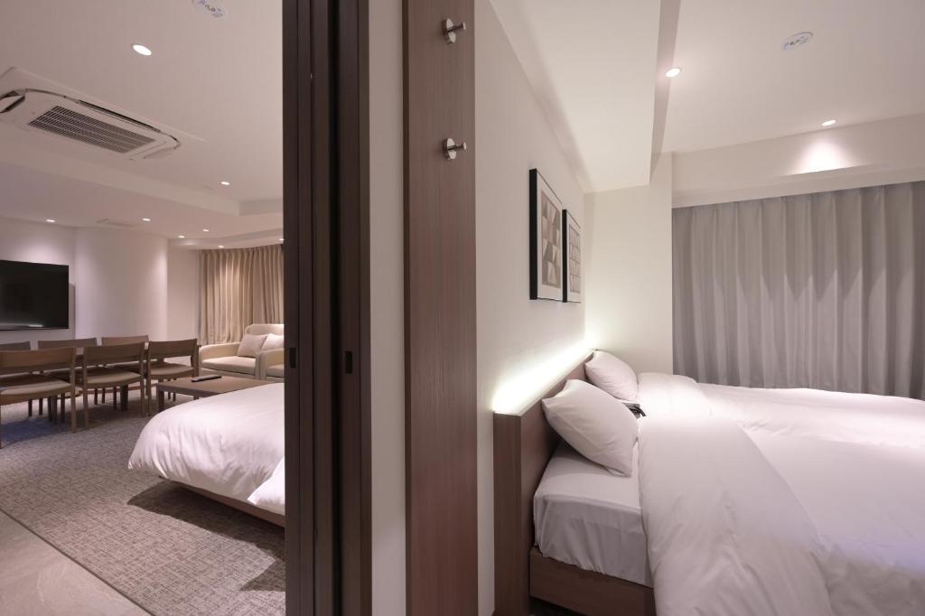 Postel nebo postele na pokoji v ubytování COCOYO Hotel 大塚