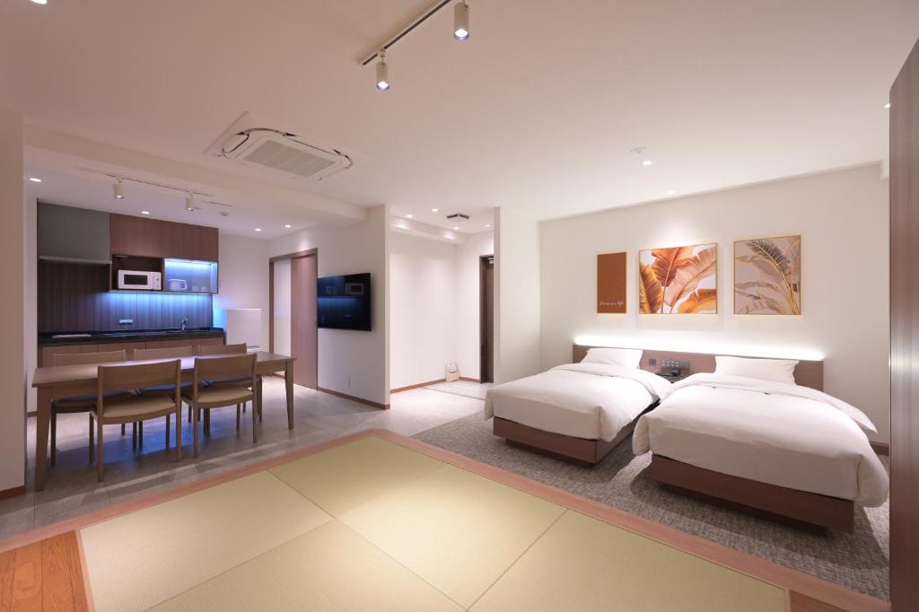 Postel nebo postele na pokoji v ubytování COCOYO Hotel 大塚