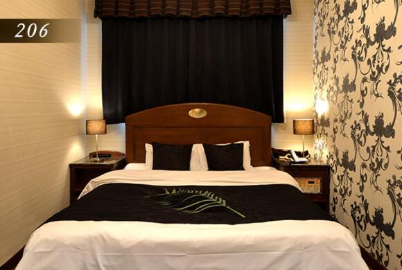 Postel nebo postele na pokoji v ubytování Hotel Ayung 大人専用