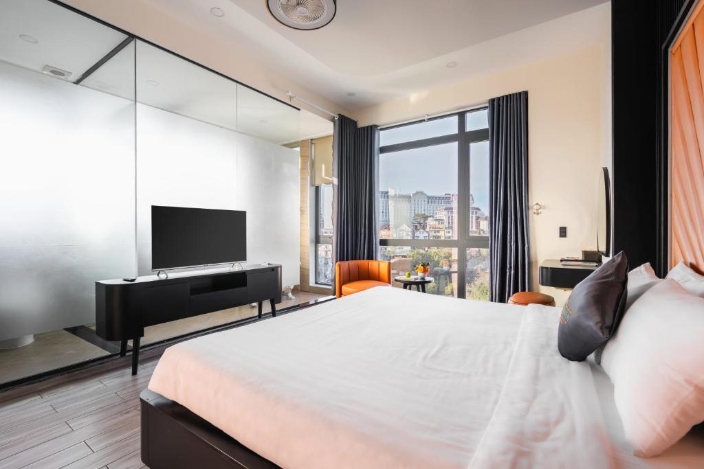 Postel nebo postele na pokoji v ubytování Greenview City Hotel