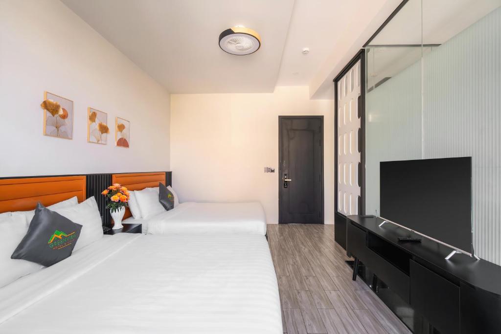 Postel nebo postele na pokoji v ubytování Greenview City Hotel