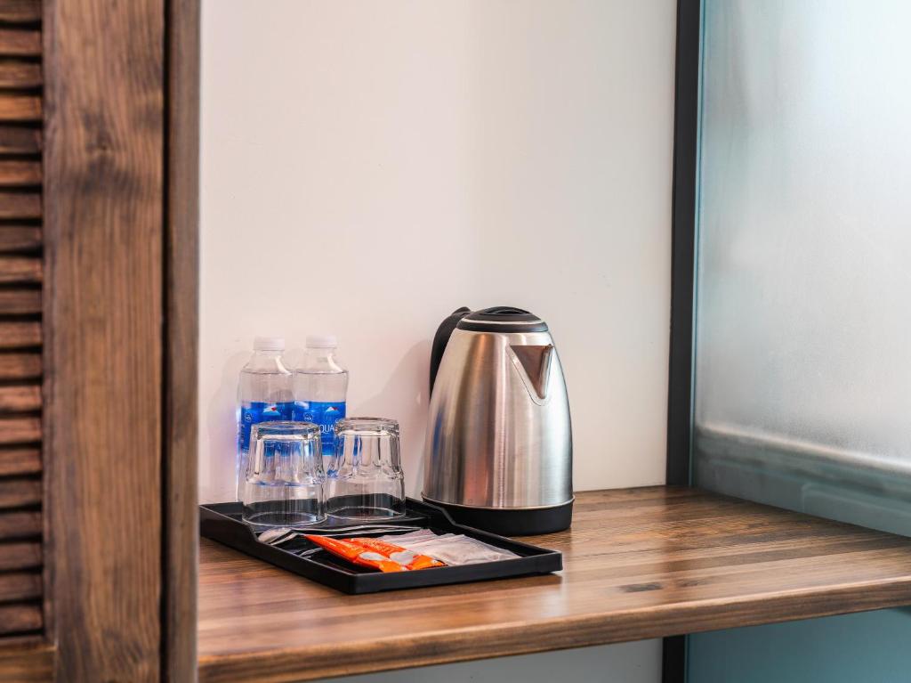 Příslušenství pro přípravu čaje a kávy v ubytování Greenview City Hotel