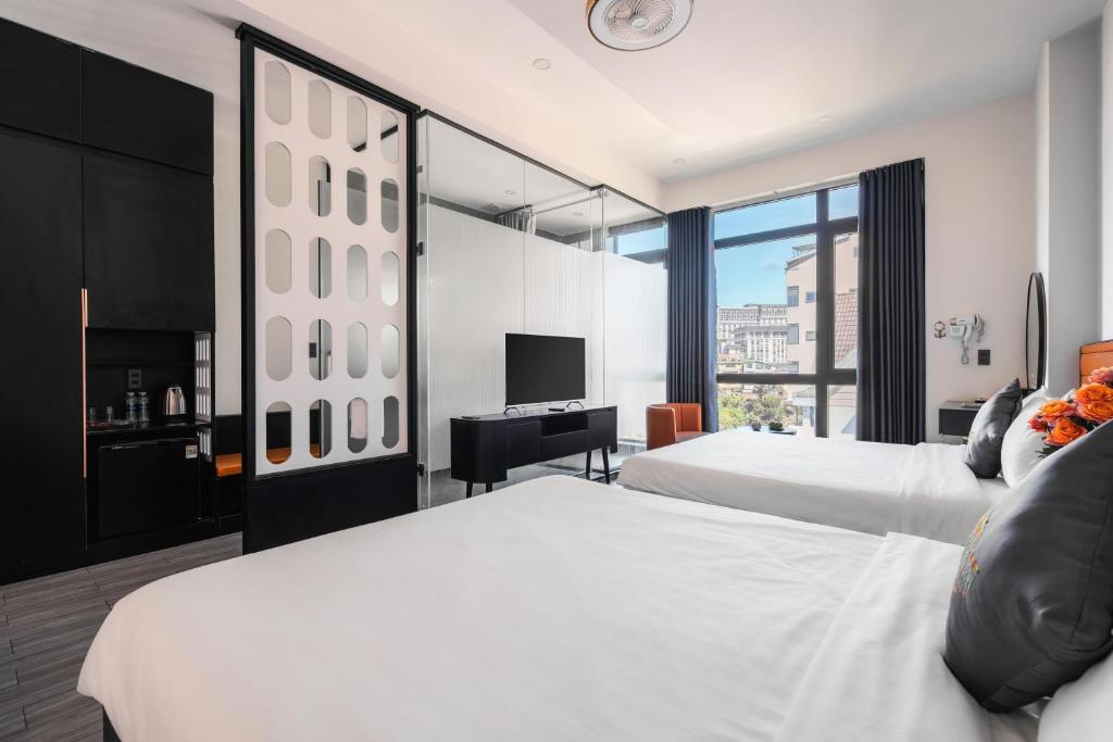 Postel nebo postele na pokoji v ubytování Greenview City Hotel