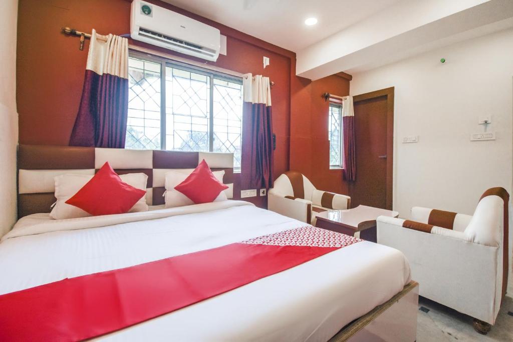 Postel nebo postele na pokoji v ubytování Super Hotel O Red Stone Near Netaji Subhash Chandra Bose International Airport