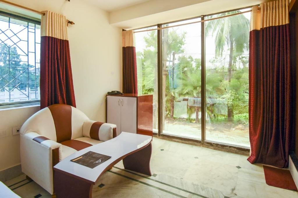 Posezení v ubytování Super Hotel O Red Stone Near Netaji Subhash Chandra Bose International Airport