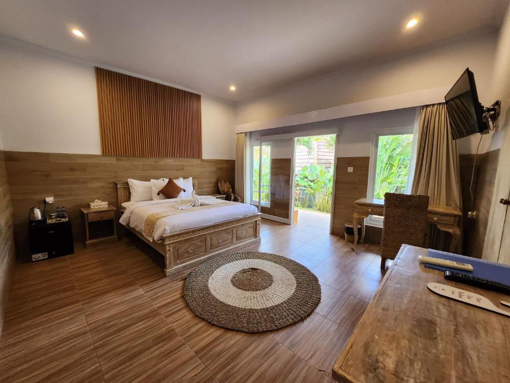 Postel nebo postele na pokoji v ubytování Agung Wiwin Homestay & Restaurant