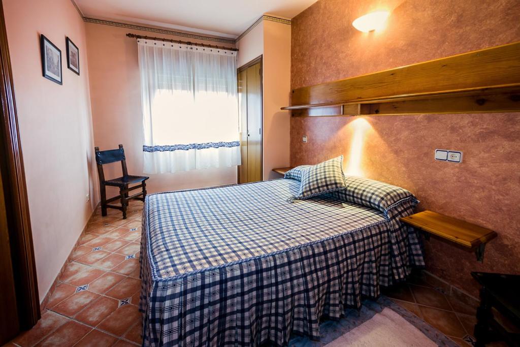 Postel nebo postele na pokoji v ubytování Hostal ROMI