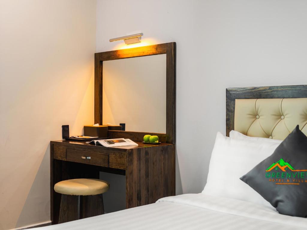 Postel nebo postele na pokoji v ubytování Greenview City Hotel