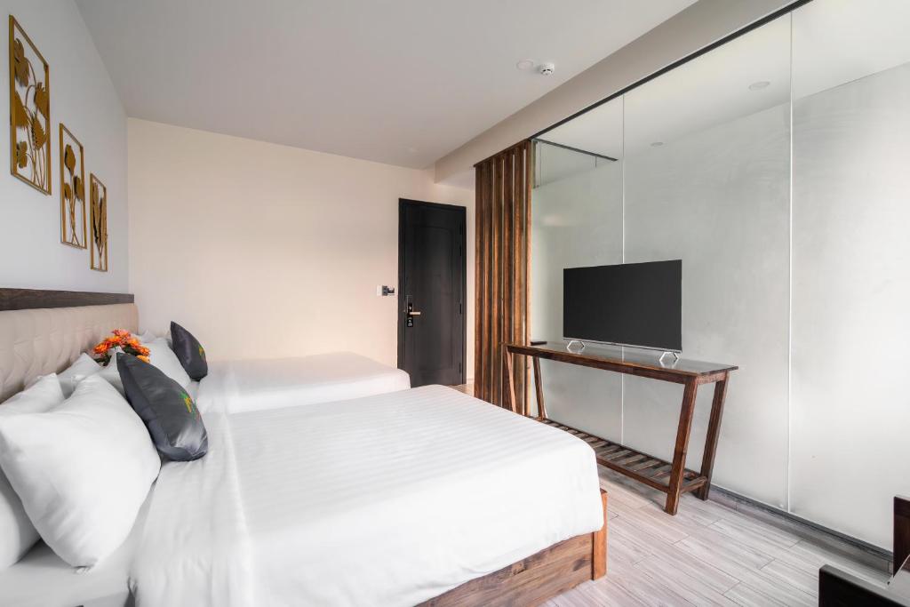 Postel nebo postele na pokoji v ubytování Greenview City Hotel