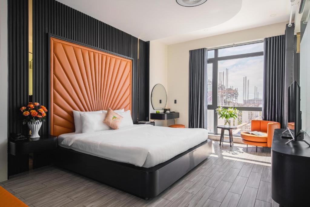 Postel nebo postele na pokoji v ubytování Greenview City Hotel