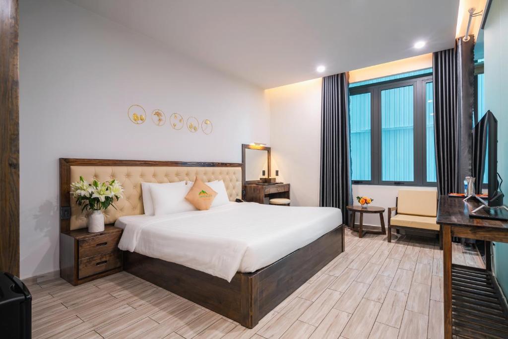 Postel nebo postele na pokoji v ubytování Greenview City Hotel