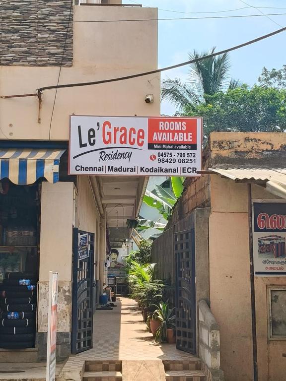 a store with signs on the side of a building at Le Grace Sivaganga in Sivaganga