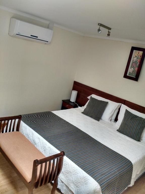 Postel nebo postele na pokoji v ubytování Hostal del Valle