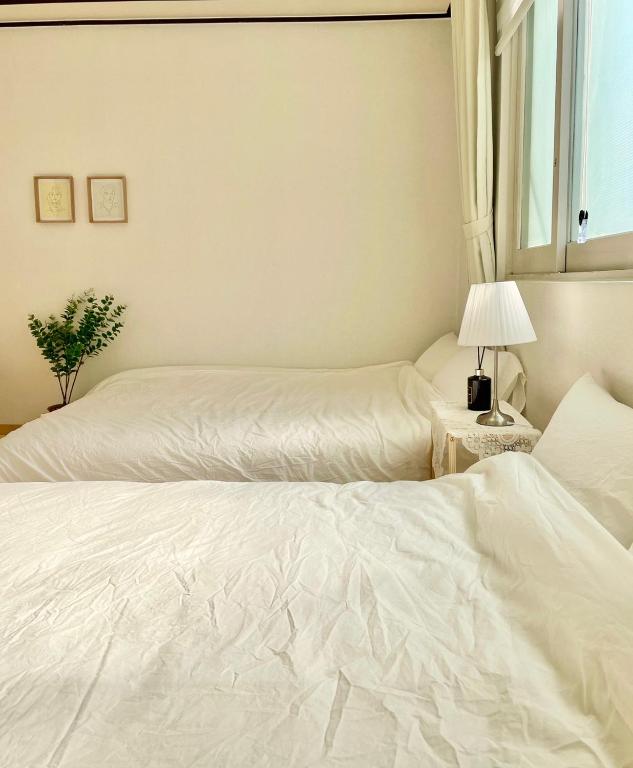 Postel nebo postele na pokoji v ubytování Slow Stay, #SK Hynix#5 minutes to Chungnam National University#10 minutes to Terminal#Hotel Bedding