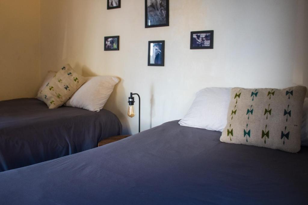 Postel nebo postele na pokoji v ubytování Casitas at Rancho Kuxtal