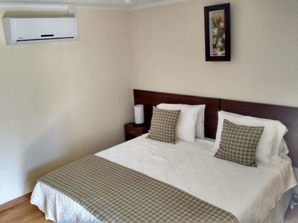 Postel nebo postele na pokoji v ubytování Hostal del Valle