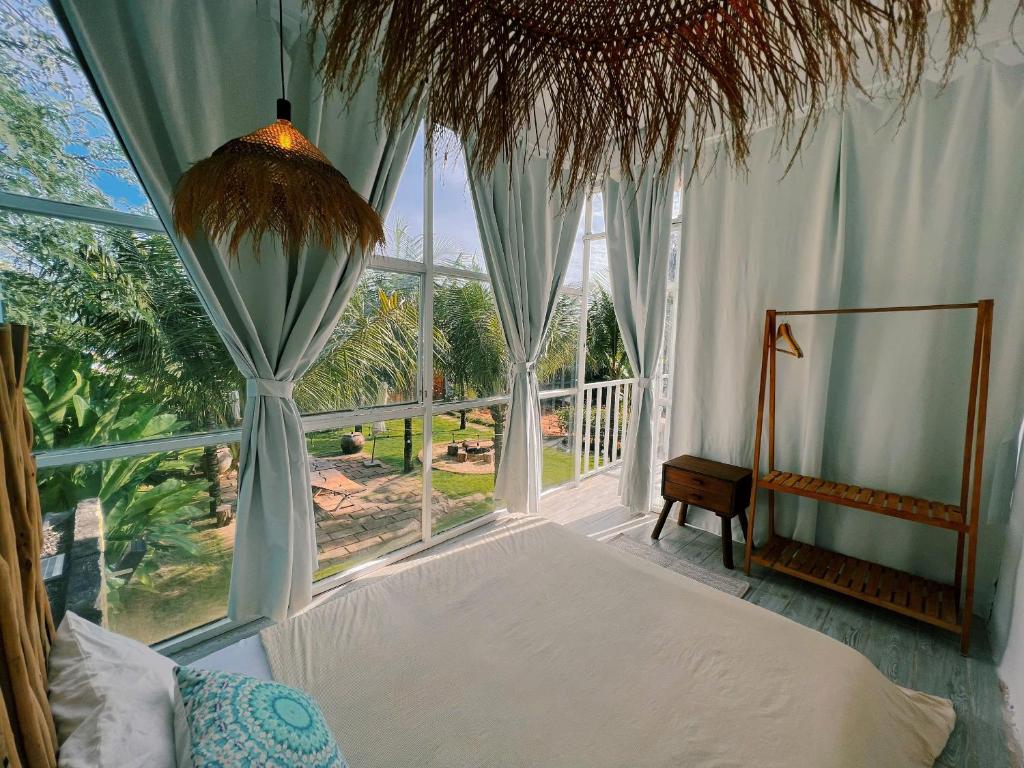 En eller flere senge i et værelse på Chon's Dock Homestay & Apartment For Lease