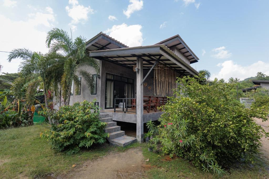a small house with a porch and stairs at Casa Eden - Double King Bed - Peaceful Garden Retreat - 4K SmartTV in Koh Phangan