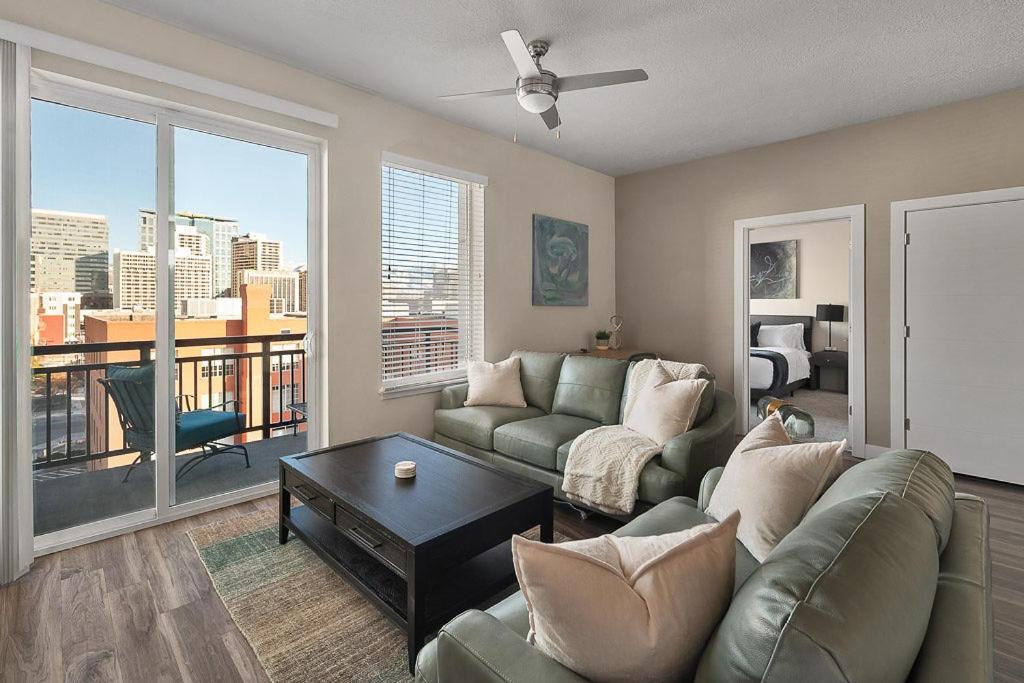 a living room with a couch and a table at Convention Ctr - Stylish 2BD,2BA with Pool,Gym and Hot tub in Salt Lake City