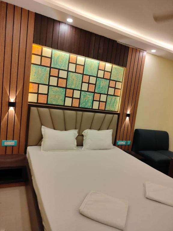 Postel nebo postele na pokoji v ubytování Sonargaon Beach Resort