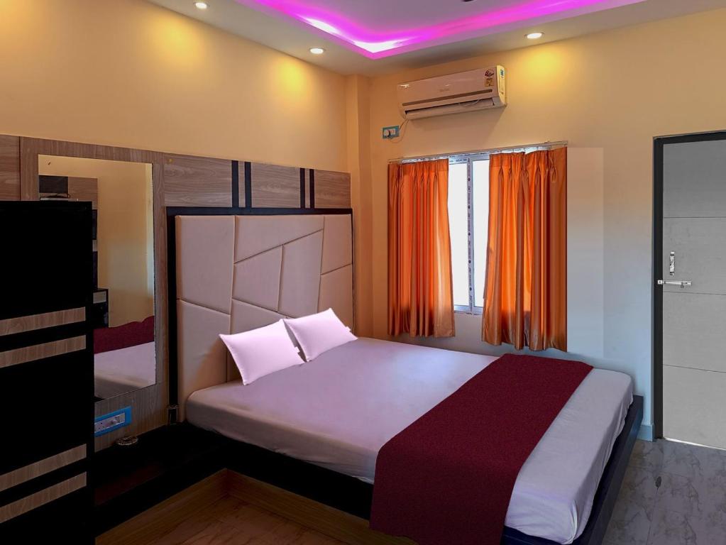 Postel nebo postele na pokoji v ubytování Sonargaon Beach Resort