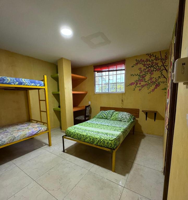 Postel nebo postele na pokoji v ubytování Hostal Bambumar