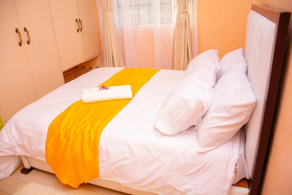 Postel nebo postele na pokoji v ubytování paradise apartments