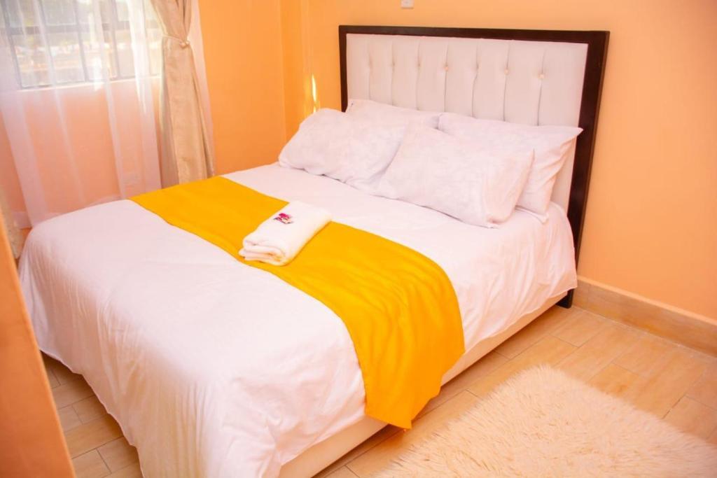 Postel nebo postele na pokoji v ubytování paradise apartments
