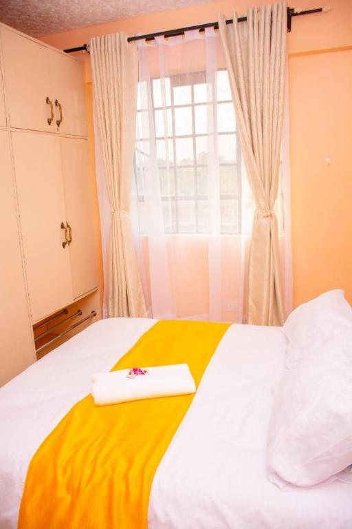 Postel nebo postele na pokoji v ubytování paradise apartments