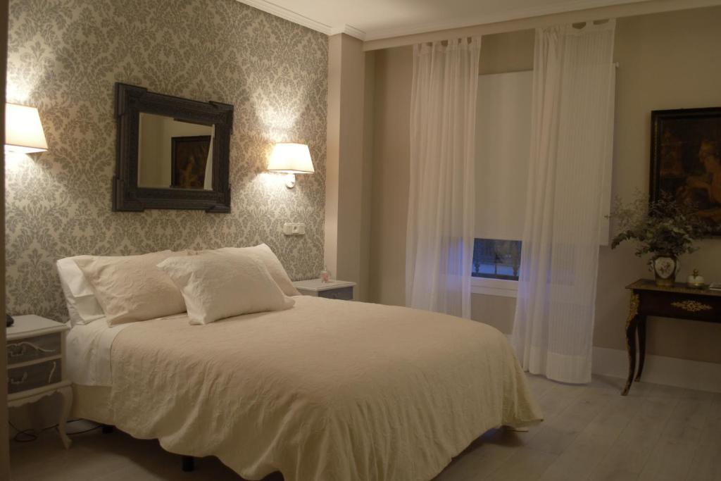 Postel nebo postele na pokoji v ubytování Ares Hotel