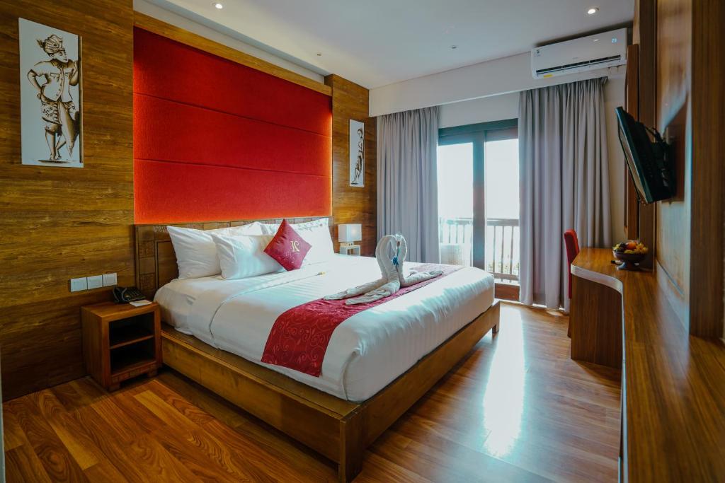 Postel nebo postele na pokoji v ubytování The Kirana Canggu Hotel