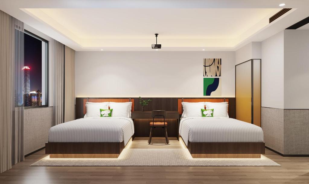 Postel nebo postele na pokoji v ubytování Mcsrh Hotel-Shenzhen Liutang