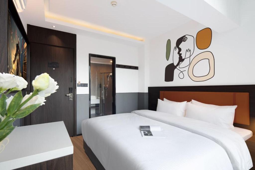 Postel nebo postele na pokoji v ubytování Mcsrh Hotel-Shenzhen Liutang