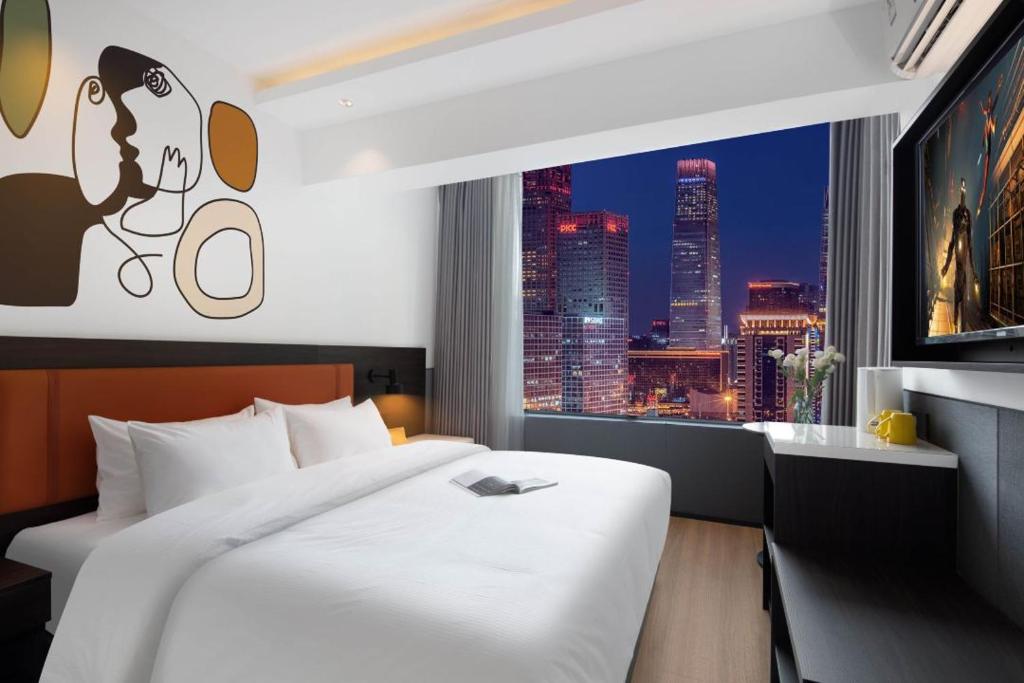 Postel nebo postele na pokoji v ubytování Mcsrh Hotel-Shenzhen Liutang