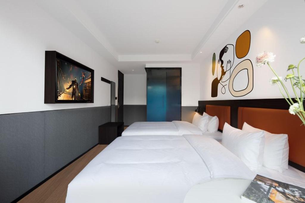 Postel nebo postele na pokoji v ubytování Mcsrh Hotel-Shenzhen Liutang