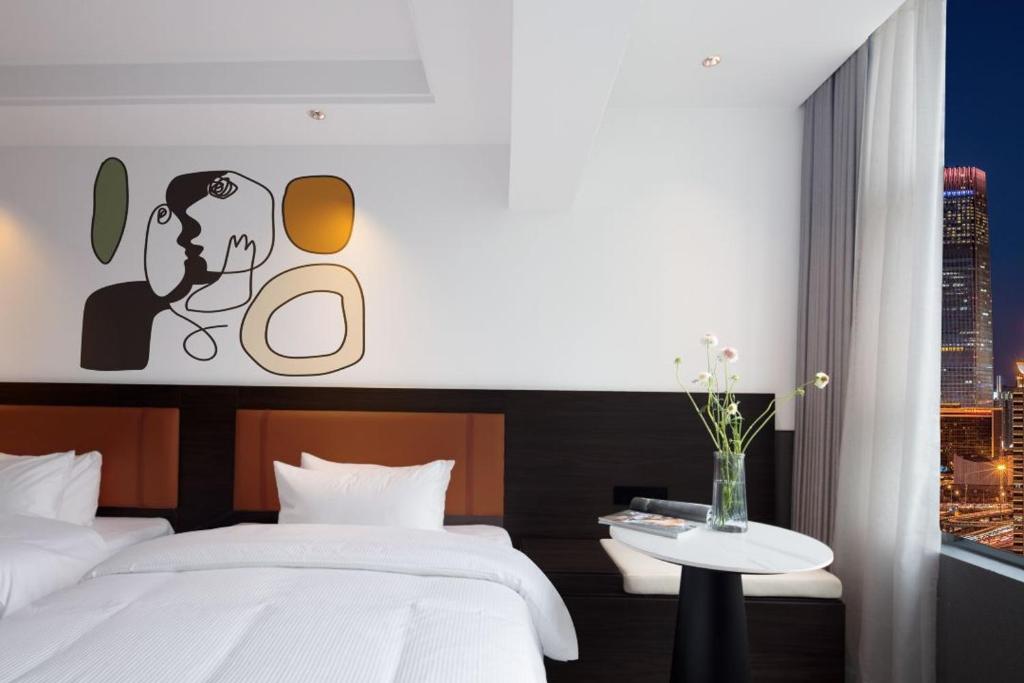 Postel nebo postele na pokoji v ubytování Mcsrh Hotel-Shenzhen Liutang