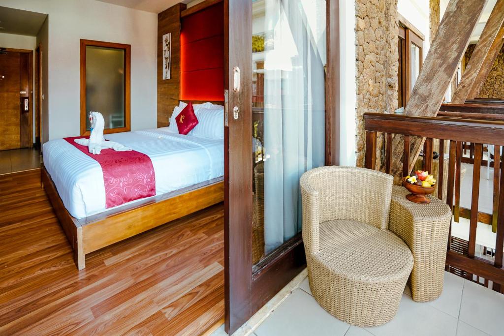 Postel nebo postele na pokoji v ubytování The Kirana Canggu Hotel